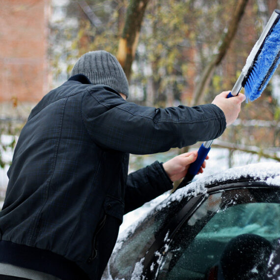 Winter,,Snow,,Vehicle.,Man,Cleaning,Car,From,Snow,With,The